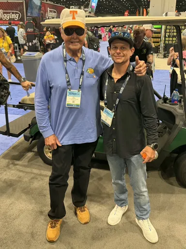 Tim at a boat show with a friend