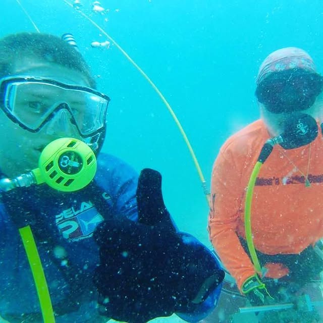 Tim diving underwater